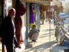 Two Men in front of Shops on Chicken Street